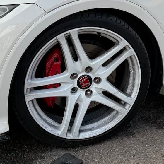 Wheel of a white Honda Civic Type R at Abidworks, Grays