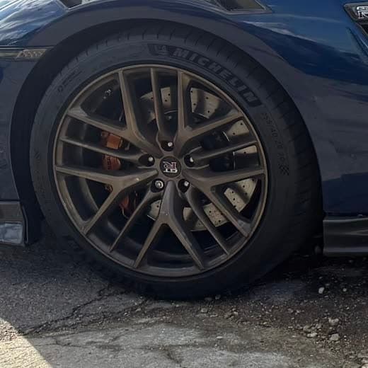 Front wheel and brake caliper of a Nissan GT-R at Abidworks, Grays