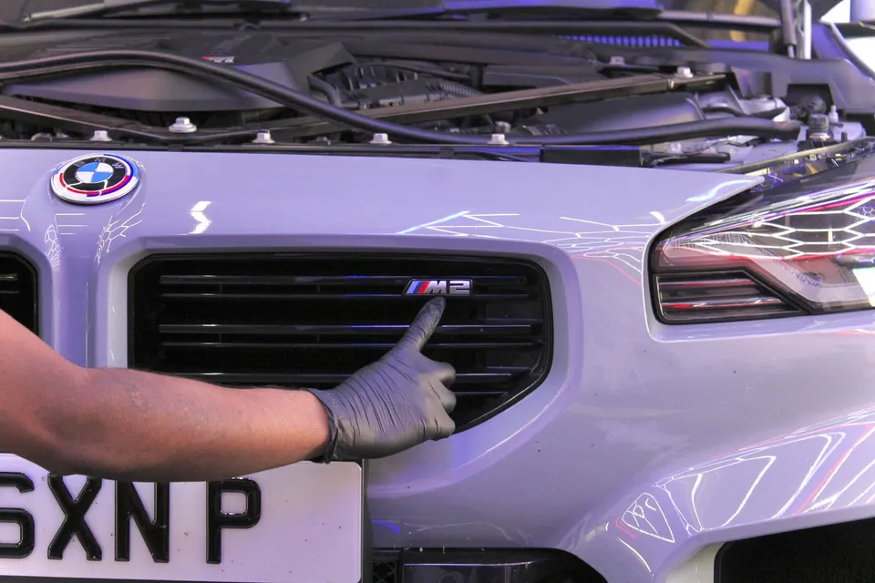 The M2 badge on the grille of a BMW M2