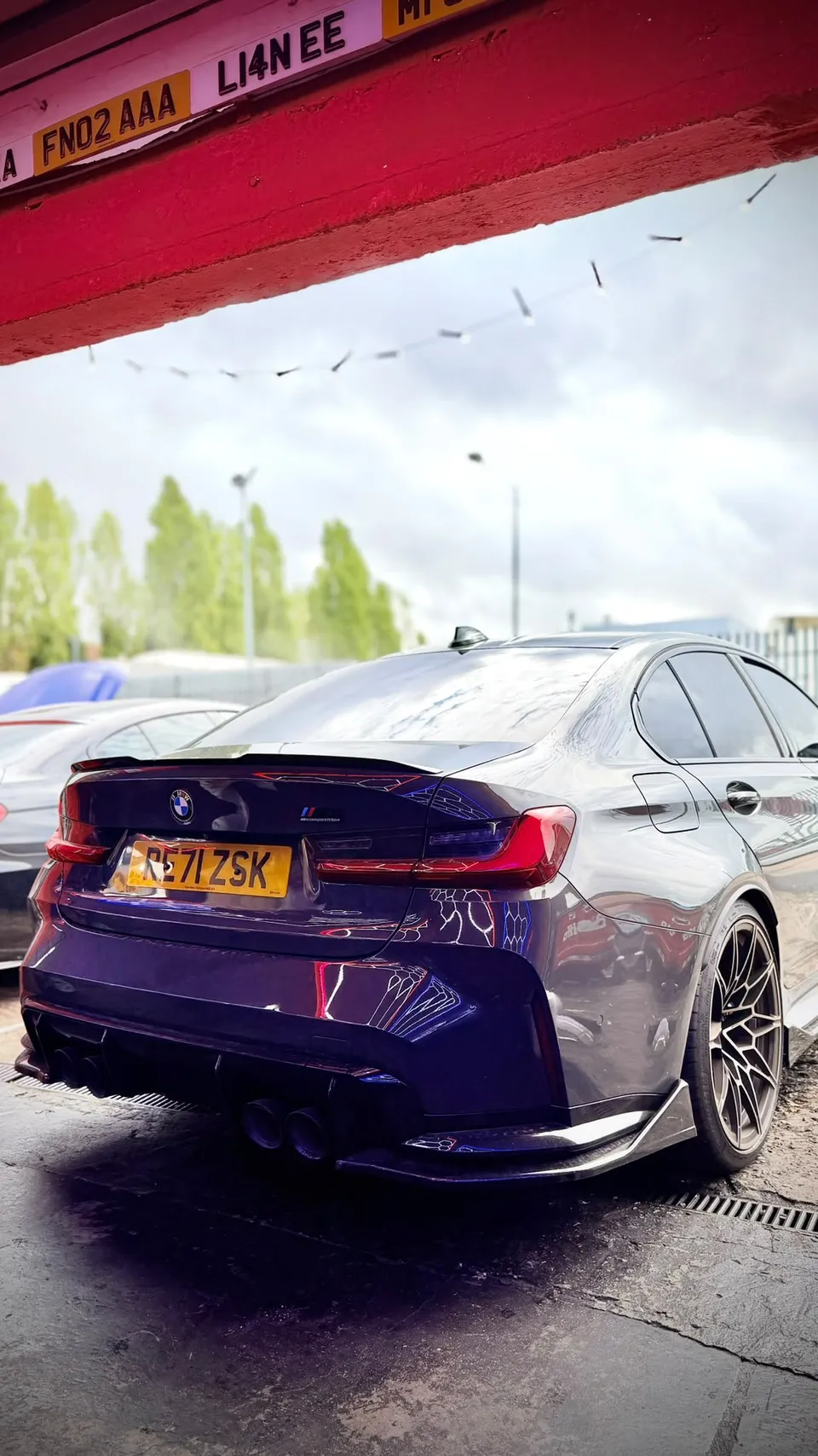 Rear of a grey BMW M3 outside the Abidworks workshop