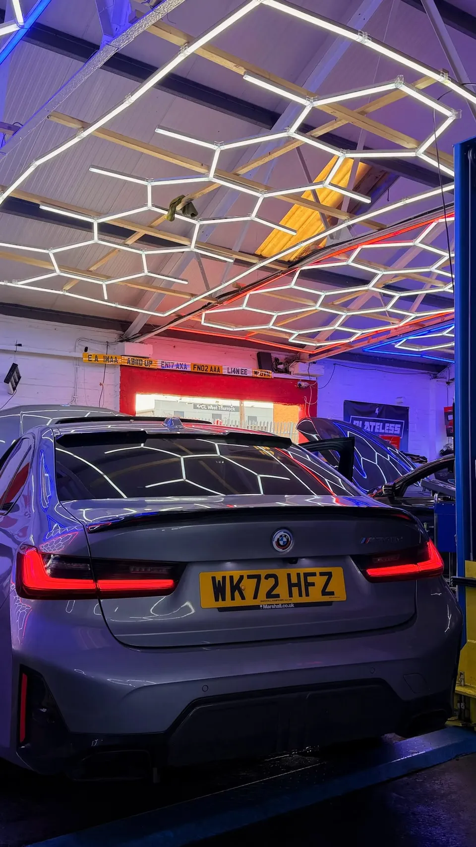 Rear of a grey BMW 3 Series in the Abidworks workshop