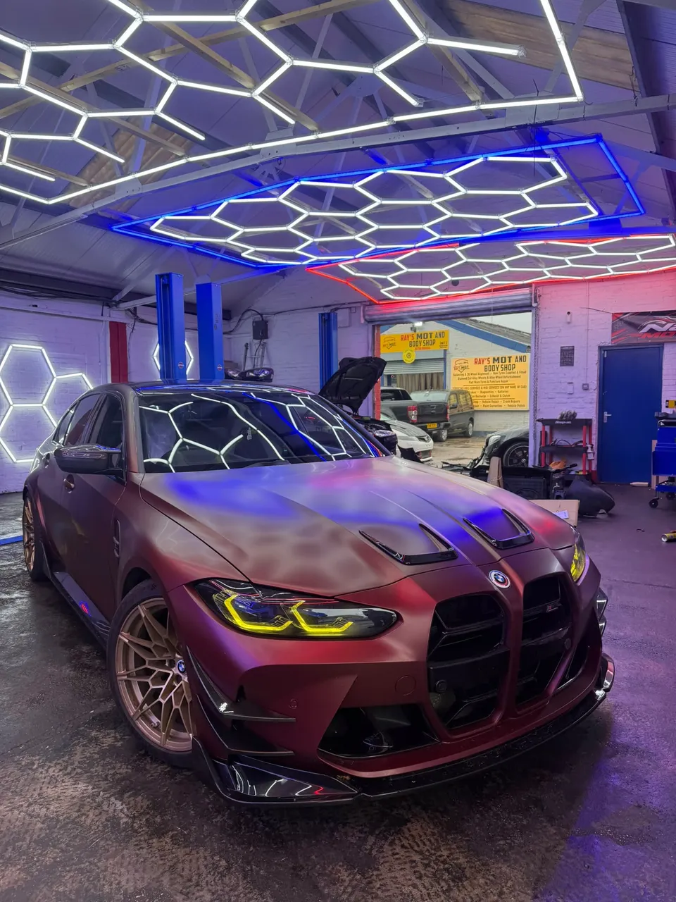 BMW M3 in the AbidWorks bay under the hex lights, in for a gearbox and front differential service