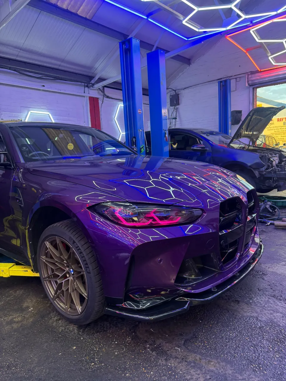 Purple BMW M3 in the Abidworks workshop, Grays